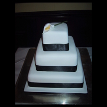 Three Tier White with White Lilly Cake